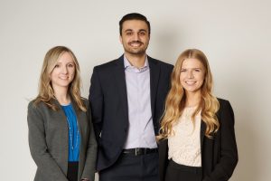 Marta, Ishpreet, and Stephanie D. stand next to each other smiling.