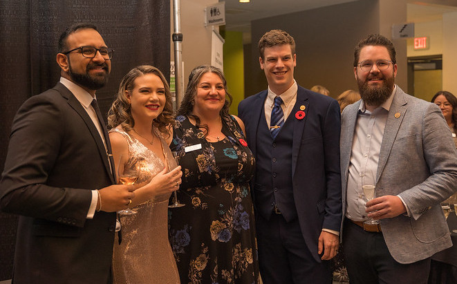 Whitney Fordham (second from left) with Alumni board members.