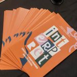 Interpret festival brochures on a table