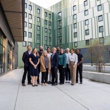 UFV alumni association board of directors standing in front of student housing at UFV
