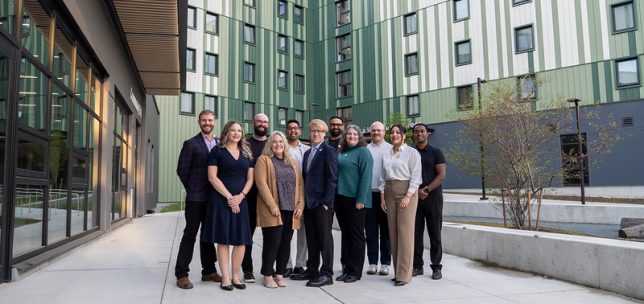 UFV alumni association board of directors standing in front of student housing at UFV